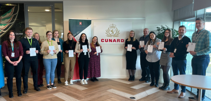 Shoreside colleagues pose with their White Star Service certificate and pin.